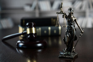 Questions To Ask Your Personal Injury Lawyer - legal book and statue of justice lady